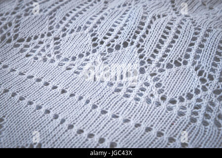Knitted woolen blue texture background. Macro, closeup Toned Stock Photo