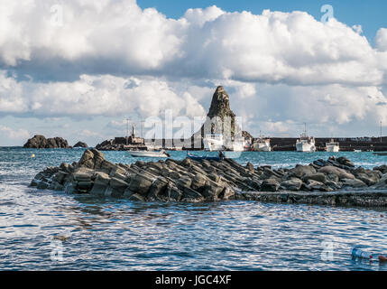 A Cyclops island, basaltic rock fomation, viwed from the port of Aci Trezza, Catania, Sicily, Italy. Stock Photo