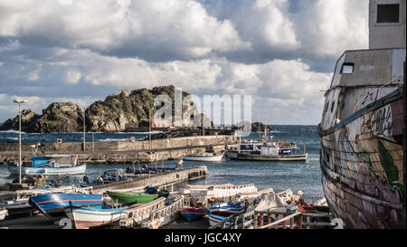 Cold and windy winter day at the port of Aci Trezza Stock Photo