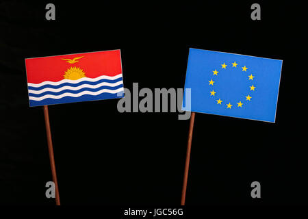 Kiribati flag with European Union (EU) flag isolated on black background Stock Photo