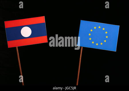 Laos flag with European Union (EU) flag isolated on black background Stock Photo