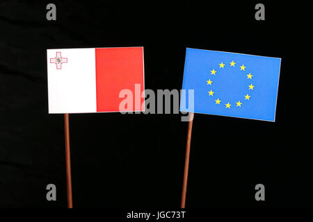 Maltese flag with European Union (EU) flag isolated on black background Stock Photo