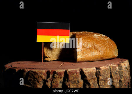 German flag on a stump with bread isolated Stock Photo