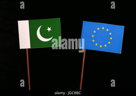 Pakistan flag with European Union (EU) flag isolated on black background Stock Photo