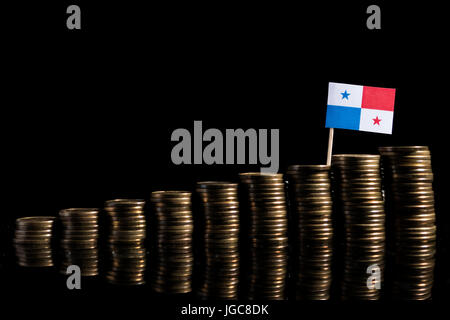 Panamian flag with lot of coins isolated on black background Stock Photo