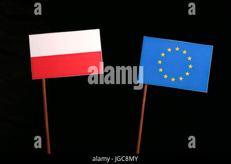 Polish flag with European Union (EU) flag isolated on black background Stock Photo