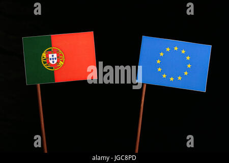 Portuguese flag with European Union (EU) flag isolated on black background Stock Photo