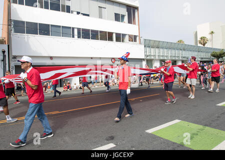 Santa Monica, California, USA.  4th July, 2017. Participants carry an American flag at the 11th Annual Szanta Monica 4th of July Parade in Santa Monica, California on July 4th, 2017.  Credit: Sheri Determan/Alamy Live News Stock Photo