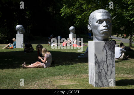 London, UK. 05th July, 2017. Frieze Sculpture 2017 opens to the public on July 5th 2017 in the English Gardens in Regents Park, London, England, United Kingdom. This is London's largest showcase of major outdoor works by leading artists and galleries, presenting a free outdoor exhibition for London and its international visitors throughout the summer months. Thomas J Price, Numen Shifting Votive One, Two and Three 2016. Credit: Michael Kemp/Alamy Live News Stock Photo