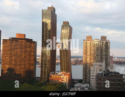 New York, New York, USA. 5th July, 2017. A view of the American Copper Buildings in Kips Bay located at 626 1st Avenue over looking the East River. The dual tower copper clad residential skyscrapers are connected by a three story skybridge. The buildings recently housed their first tenants between the 41 story and 48 story towers. Credit: Nancy Kaszerman/ZUMA Wire/Alamy Live News Stock Photo