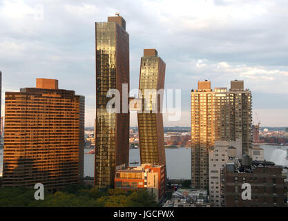 New York, New York, USA. 5th July, 2017. A view of the American Copper Buildings in Kips Bay located at 626 1st Avenue over looking the East River. The dual tower copper clad residential skyscrapers are connected by a three story skybridge. The buildings recently housed their first tenants between the 41 story and 48 story towers. Credit: Nancy Kaszerman/ZUMA Wire/Alamy Live News Stock Photo