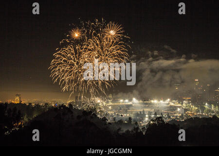 Los Angeles, California, USA. 4th July, 2017.  Fireworks sparkle in the sky over a view of Los Angeles after the baseball game at Dodger Stadium in Los Angeles, California on July 4th, 2017.  Credit: Sheri Determan/Alamy Live News