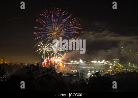 Los Angeles, California, USA. 4th July, 2017.  Fireworks sparkle in the sky over a view of Los Angeles after the baseball game at Dodger Stadium in Los Angeles, California on July 4th, 2017.  Credit: Sheri Determan/Alamy Live News Stock Photo