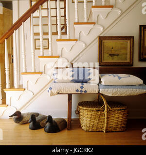 Blankets on bench by staircase Stock Photo