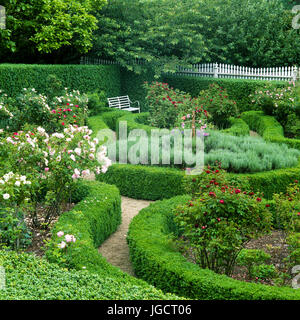 Flower garden with hedges Stock Photo