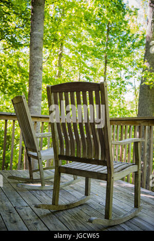 Rocking Chairs on Deck in Woods Stock Photo