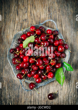 Overhead view of cherries on a pewter dish Stock Photo