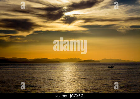 A Fisherman Is Silhouetted At Sunset In The Mediterranean Sea Near 