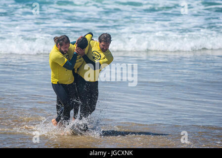 Beach Lifeguard Training on Fistral Beach in Cornwall.  The course is run by Era Adventures. Stock Photo