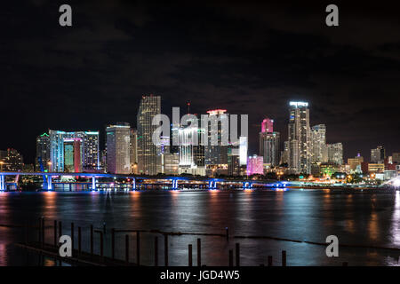 Miami city night skyline across Biscayne Bay Stock Photo