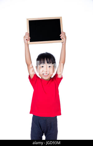 Asian little Chinese girl holding a blackboard in isolated white background Stock Photo