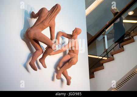 Southbank Centre employee Rebbeca Simpson views The Sunbathers sculpture on display at the Southbank Centre, Royal Festival Hall in London, which went missing after it was shown on the wall of an entrance to Waterloo station for the 1951 Festival Of Britain. Stock Photo