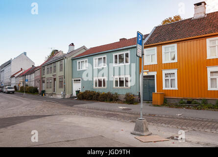 Scandinavian wooden houses stand along old street in Trondheim, Norway Stock Photo