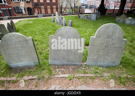 winged skull and crossbones and willow and urn on gravestones in copps hill burying ground Boston USA Stock Photo