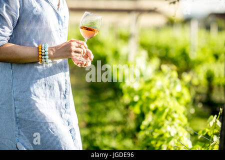 Woman tasting wine outdoors Stock Photo