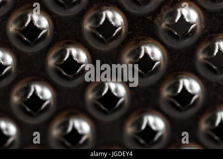 macro shot of a lemon zester on a cheese grater Stock Photo