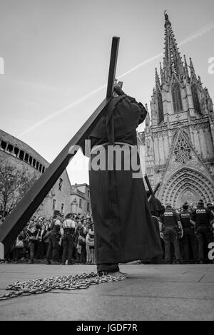 Penitents, Nazarenos, in their typical hooded robes during the festivities of Semana Santa, Holy Week, procession, Good Friday.  Barcelona Spain Stock Photo