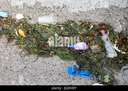plastic waste washed up on slipway in the uk Stock Photo