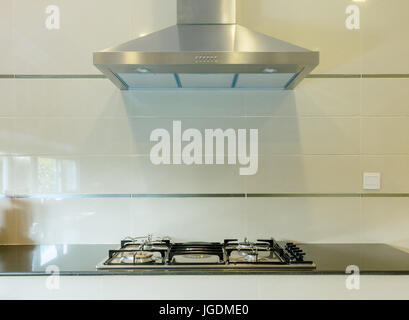 cooking gas stove with hood in modern kitchen Stock Photo