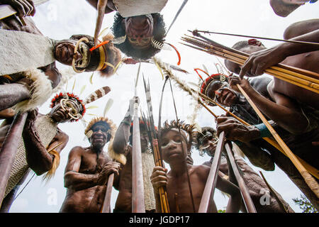 DANI VILLAGE, WAMENA, IRIAN JAYA, NEW GUINEA, INDONESIA – 15 MAY 2012: Dani tribe Warriors. Stock Photo