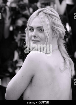 Elle Fanning depart after the How To Talk To Girls At Parties screening during the 70th annual Cannes Film Festival at Palais des Festivals on May 21, 2017 in Cannes, France. Stock Photo