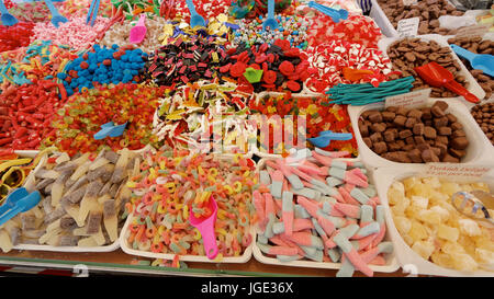 colorful selection of sweets or candy colourful market stall choice of children pick and mix foreign sweetmeats pik n mix Glasgow Christmas market Stock Photo