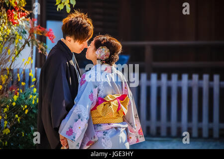 Unidentified groom and bride dress traditional costume for their wedding at Yasaka-jinja Shrine in Kyoto, Japan Stock Photo