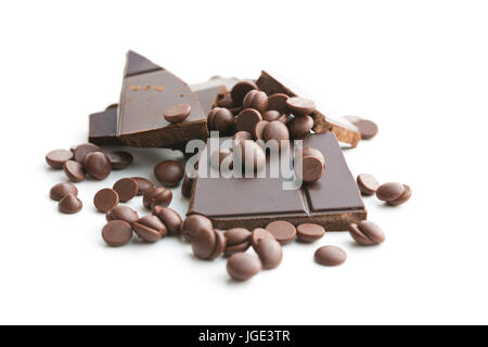 Tasty chocolate morsels and chocolate bar isolated on white background. Stock Photo