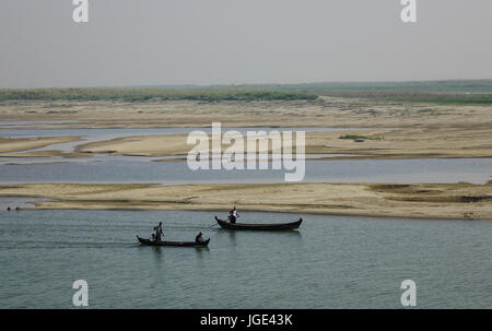 Mandalay, Myanmar - Feb 10, 2017. Wooden boats on the Irrawaddy River in Mandalay, Myanmar. Irrawaddy is the country largest river and most important  Stock Photo