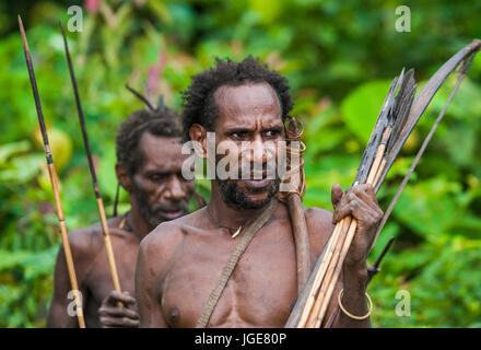 INDONESIA, ONNI VILLAGE, NEW GUINEA - JUNE 24: Man Korowai tribe. Tribe of Korowai (Kombai , Kolufo). Stock Photo