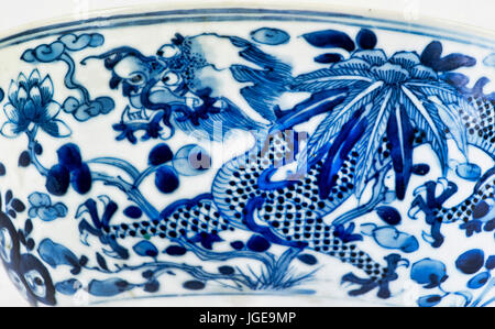 Closeup of antique 18th century Chinese porcelain four claw dragon. Stock Photo