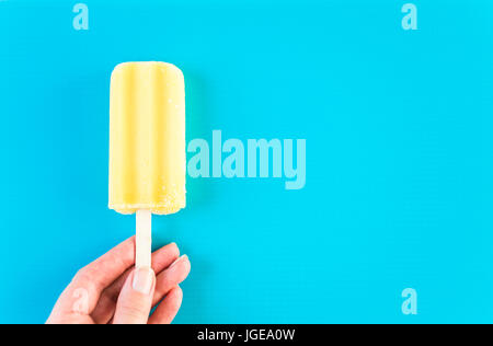 Multicolored fruit ice cream bars on colored background. Stock Photo