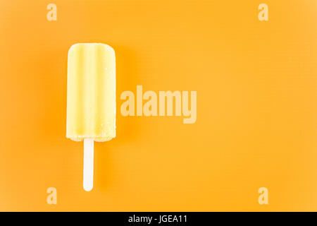 Multicolored fruit ice cream bars on colored background. Stock Photo