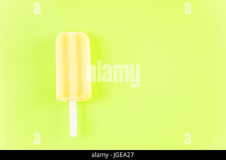 Multicolored fruit ice cream bars on colored background. Stock Photo