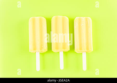 Multicolored fruit ice cream bars on colored background. Stock Photo