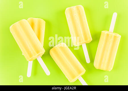 Multicolored fruit ice cream bars on colored background. Stock Photo