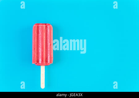 Multicolored fruit ice cream bars on colored background. Stock Photo