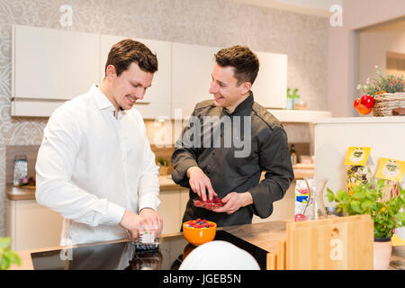 Cook gives a cooking course Stock Photo