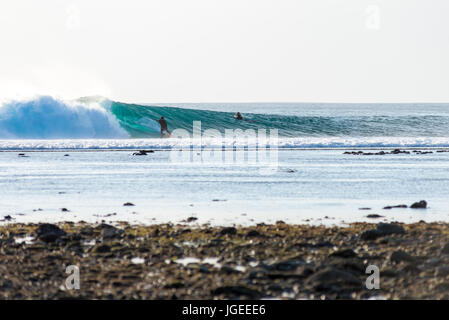 7th June 2017; Desert Point, Lombok, Indonesia.; Surfers from around the world enjoy the extreme swell of tube waves at this remote world class surf s Stock Photo
