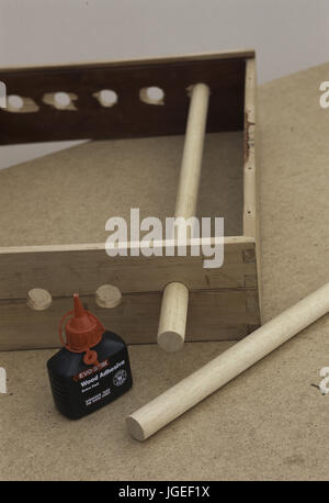 Wooden frame with dowels. Making a suspended wooden storage rack. Step x step craft and DIY projects Stock Photo